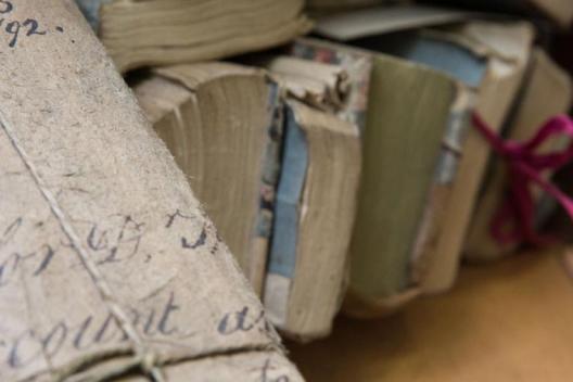 Historic documents tied with a ribbon