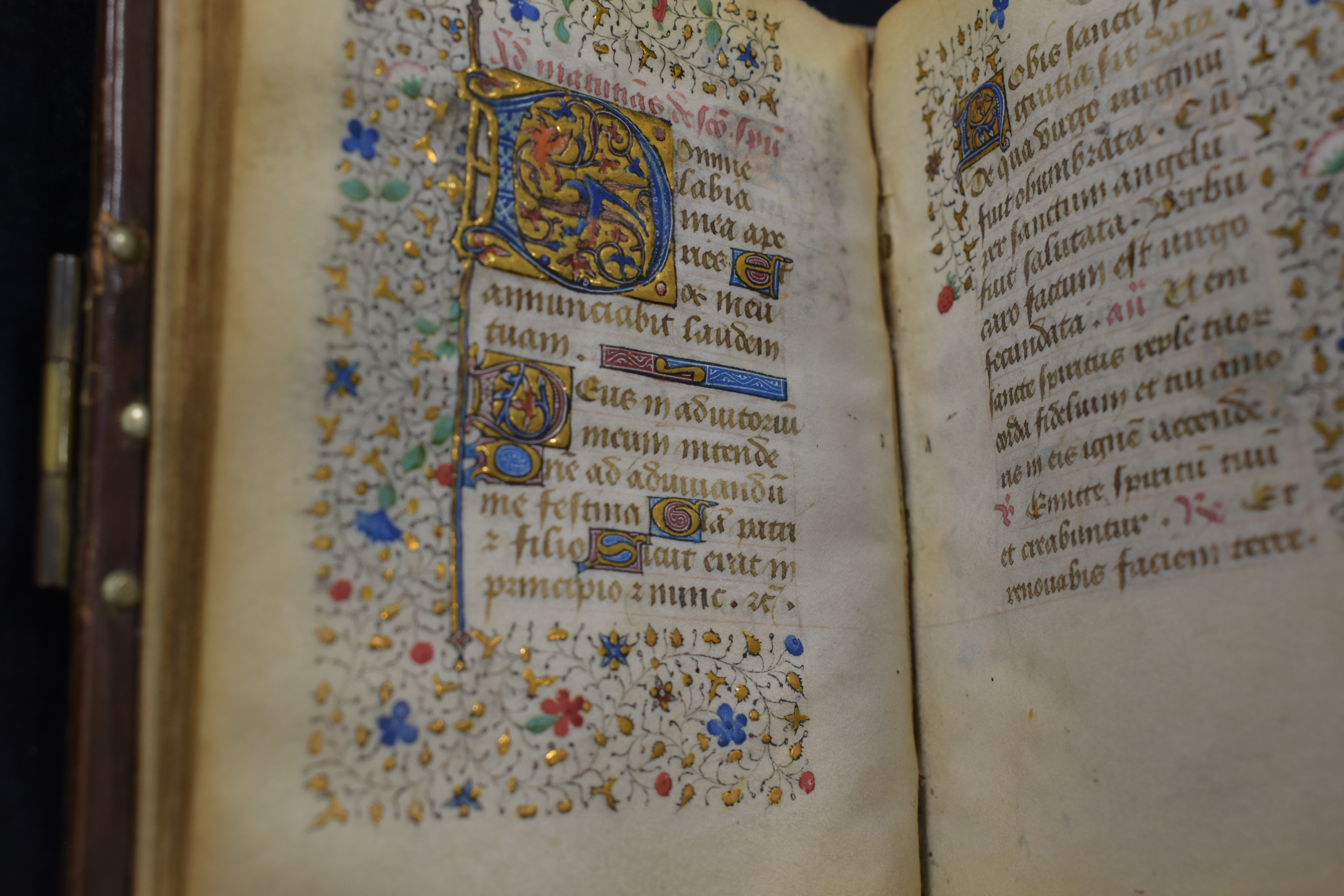 The Book of Hours, a historic book richly decorated in gold and blue with red and green highlights