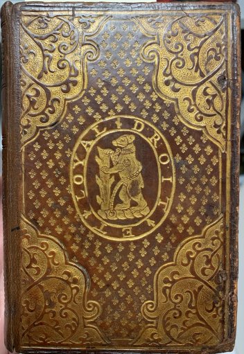 Armorial bindings were often used to show ownership on the outside of a volume. Robert Dudley, Earl of Leicester, used the bear and ragged staff of the earls of Warwick as an heraldic device and he may have had several books bound with this stamp. Roger Ascham was Latin secretary to Queen Elizabeth I, composing some of her most important documents, and Dudley was a very close friend of the Queen.