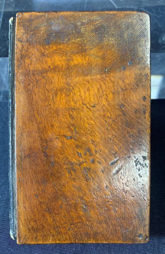 The Mary Rose is now world-famous as Henry VIII's favourite ship, but her resting place was forgotten until she was found again in the 1830s after fouling a fisherman's nets. The ship was part of the first commercial diving operations in the Solent. The divers took wood and objects from the ship and sold souvenirs, such as this book about its discovery bound in the wood of the ship to raise money for their operations.
